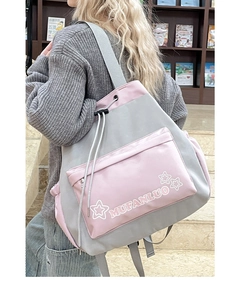 Detail of grey and pink contrast drawstring backpack with MUFANLUO brand logo print