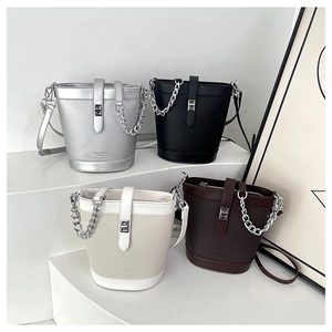 Collection of textured leather bucket bags in silver, black, cream, and brown finishes