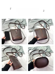 Detail view of brown textured leather bucket bag showing front back and side angles