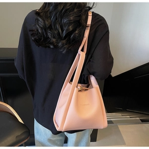 Pink lychee grain leather bucket bag featuring Famrco logo and gold tone hardware
