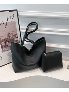 Classic black faux leather tote bag with matching zipper pouch and pebble texture