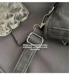 Detailed macro view of silver hardware adjustment buckle on gray frosted tote bag