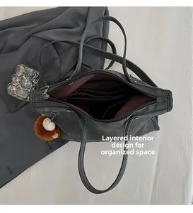 Macro detail of the organized internal layered design and compartments of the tote bag
