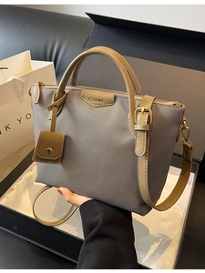 Grey canvas and khaki leather tote bag with CLEAROK logo and adjustable strap