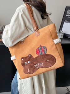 Yellow corduroy tote bag with cartoon cat patch and brown faux leather straps for women