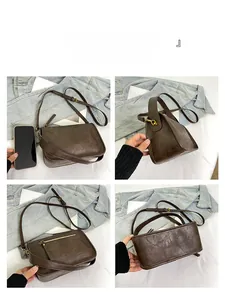 Détails d'un sac bandoulière vintage marron foncé montrant les zips et le cuir