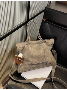 Vintage oversized rivet tote bag in gray-brown matte finish with tassel and bear charm