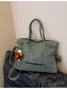 Retro large tote bag with rivets and tassels in dark green matte finish with top handles