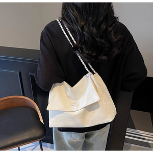 Detail of off-white Hobo shoulder bag with star logo and chain woven strap detail