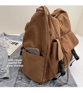 Close-up of side zipper pocket on large nylon tote bag for convenient phone storage