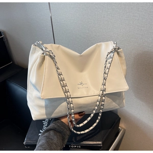 Detail of white soft leather tote with Michtam logo and silver chain shoulder strap