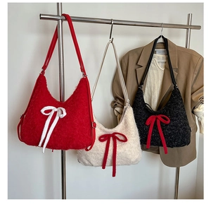 Close-up of plush mohair tote bag featuring a contrasting bow and soft fuzzy texture