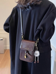 Retro dark brown crossbody phone bag with fuzzy charm and gold fashion lettering