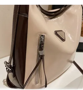 Detailed macro view of the smooth silver zipper and contrast stitching on the tote bag