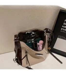 Interior view of large tote bag showing capacity for umbrella, makeup, and phone