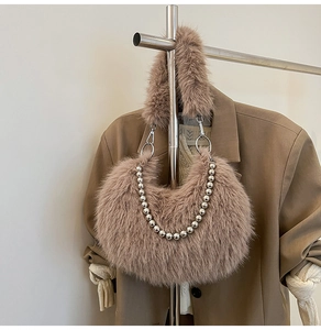 Detail view of mocha brown fuzzy shoulder bag with silver bead chain and soft faux fur texture