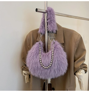 Detail of purple fluffy plush bag showing soft faux fur and elegant silver bead chain