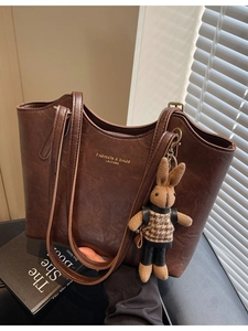 Vintage brown large capacity tote bag with adjustable straps and a cute rabbit charm