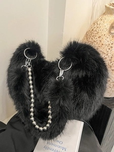 Black faux fur hobo bag featuring luxury pearl chain strap and fuzzy texture details