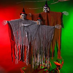 Detail of hanging skeletons with wizard hats and tattered gauze for Halloween decor