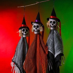 Three hanging skeleton ghosts with pointed witch hats and colored mesh for Halloween decor