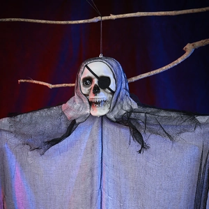 Close-up of Halloween skull hanging ghost with black eye patch and mesh robe decor