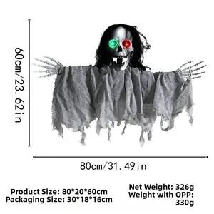 Detail of glowing LED eyes on a hanging Halloween ghost with skeletal hands and tattered robe