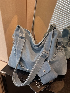 Blue denim tote bag with silver chain and matching mini pouch for women