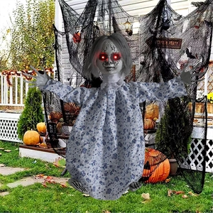 Detail of Halloween glowing doll with red LED eyes and floral dress for party decor
