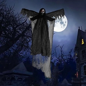 Hanging Halloween grim reaper with glowing red eyes and moving wings in a spooky garden