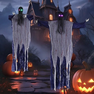 Halloween hanging ghosts with long hair and glowing LED eyes in a spooky castle setting