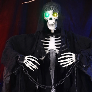 Close-up of hanging Halloween reaper with glowing eyes, plastic chains and black mesh robe