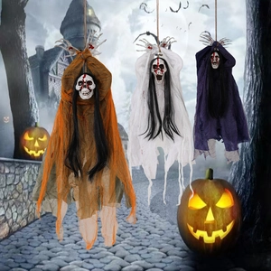 Three Halloween hanging ghost skeletons with messy hair and tattered gauze for party decor