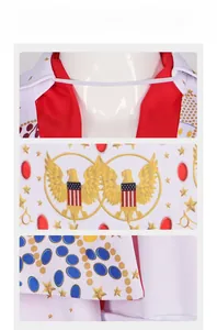 Close-up of white Elvis costume featuring gold star patterns and a patriotic eagle crest
