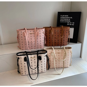 Four large faux leather tote bags with bear print patterns in pink brown white beige