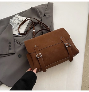 Close-up of vintage brown matte backpack with silver buckles and flap design details