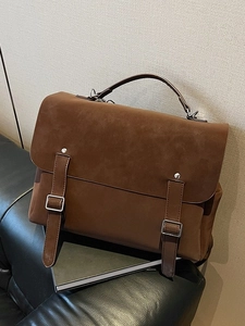 Brown vintage frosted backpack tote with leather straps and silver buckle detail