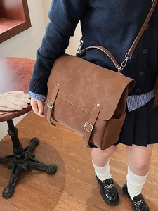 Retro frosted brown messenger backpack for women with vintage texture and silver buckles