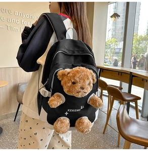 Cute black backpack with 3D teddy bear doll and white KEKEMI logo street style view