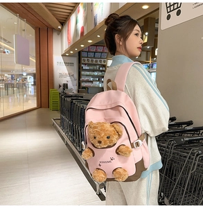 Pink student backpack featuring a 3D plush bear doll and KEKEMI logo on side view
