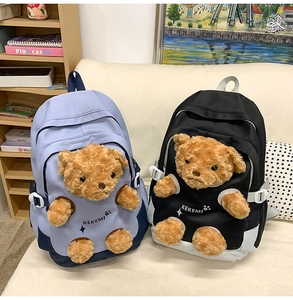 Close-up of cute teddy bear plush limbs design on canvas backpacks for students