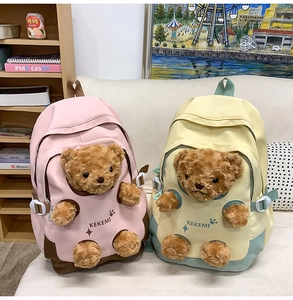 Close-up of cute bear plush backpack for students in pink and yellow pastel colors
