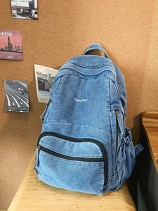 Mochila vintage de mezclilla azul para mujer con logotipo 7street bordado frontal