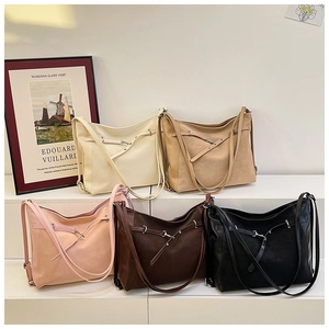 Close-up of stylish large tote bags in five neutral colors with elegant silver hardware