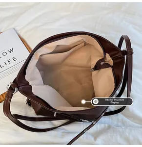 Internal structure display of a large brown tote bag with zipper and inner pockets