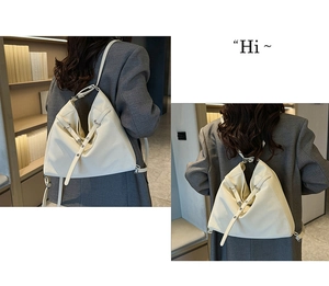 Detail of white leather multi-functional backpack showing straps and minimalist design