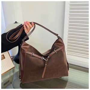 Detail of dark brown tote bag featuring textured suede and smooth PU leather finish