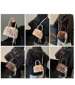 Multiple views of a vintage shell handbag with detachable strap and woven charms