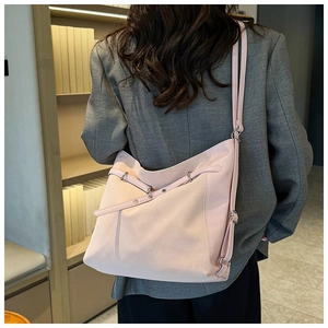 Detailed back view of a pink high-capacity nylon tote bag with adjustable shoulder straps