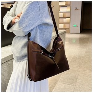 Brown matte large-capacity shoulder bag with sleek metal ring detail for casual commuting